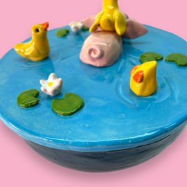 Koektrommel zwemmend varkentje