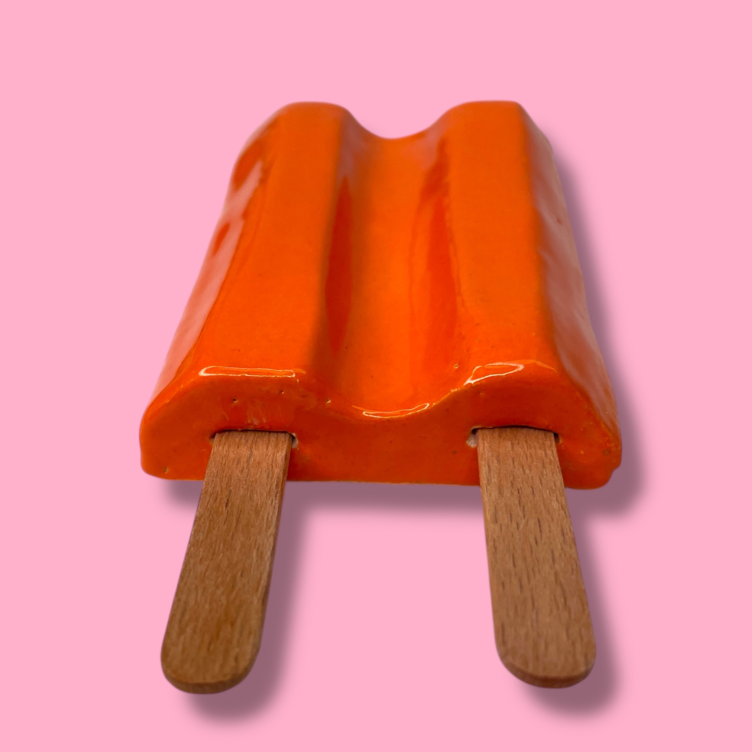 Dubbellikker van keramiek oranje