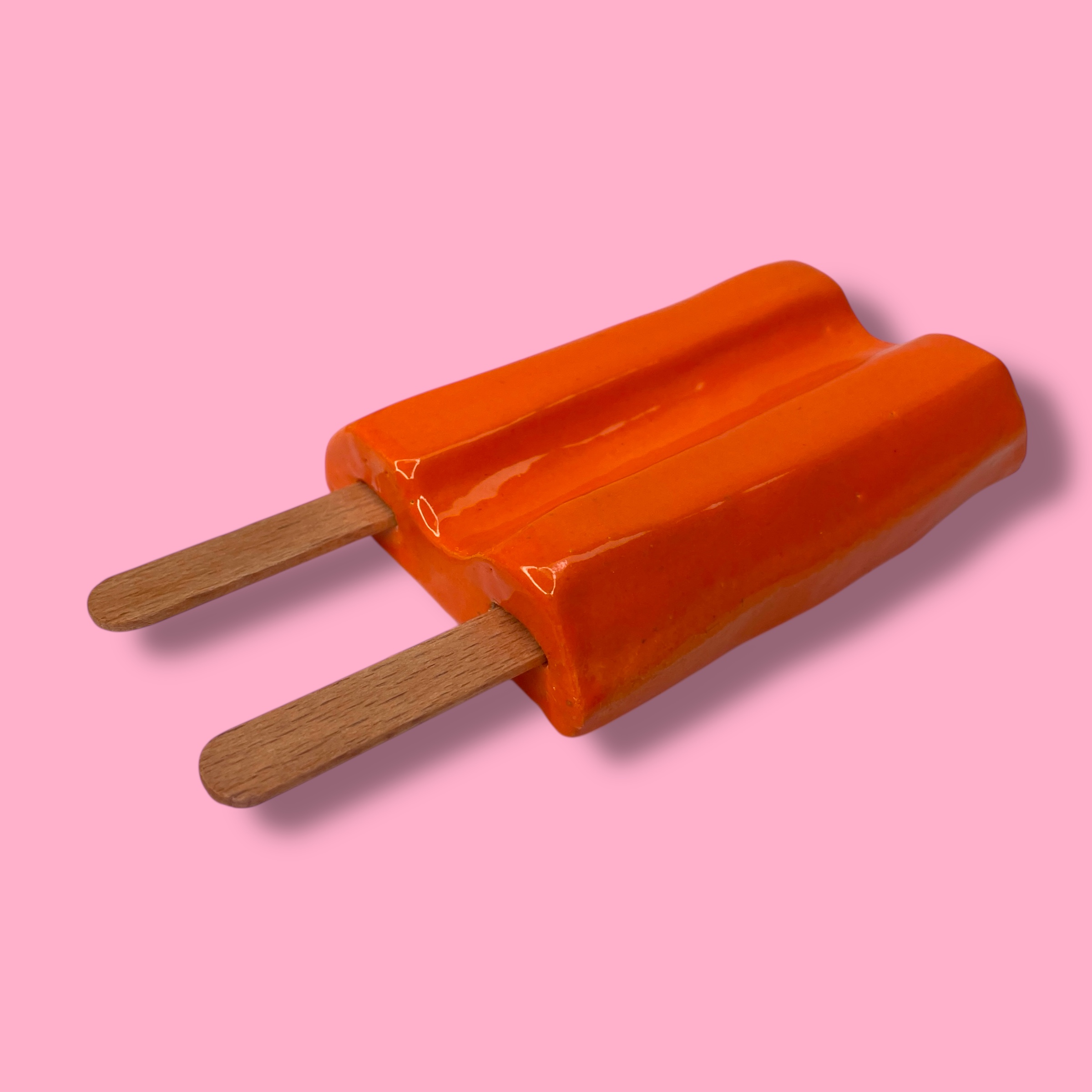 Dubbellikker van keramiek oranje