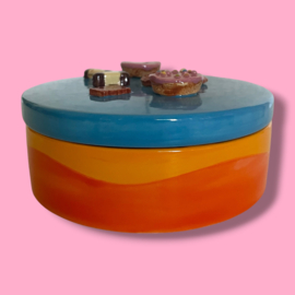 Koekjes koektrommel oranje gegolfd blauw deksel