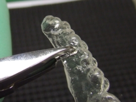 CLEAR ALIGNER RETENTION TANG
