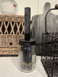 Glazen pot met 3 zwarte kaarsen