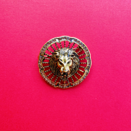 Gold lion with gemstones brooch