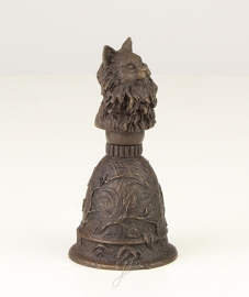 Een bronzen tafelbel met kat afbeelding