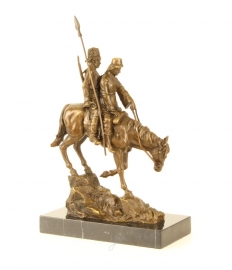EEN BRONZEN SCULPTUUR GENAAMD "BERGAFWAARTS RIDE"