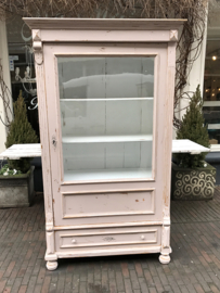 Old pink cabinet with glass