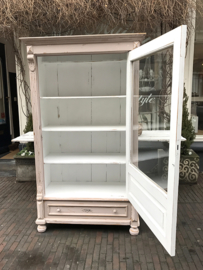 Old pink cabinet with glass