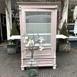Old pink cabinet with glass