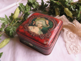 VERKOCHT Oud blikje met dame