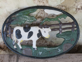 Brocante Franse ovale gietijzeren onderzetter koe