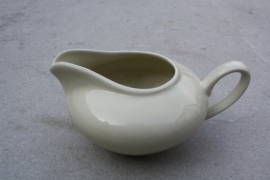 Lage brede beige melkkan