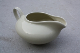 Lage brede beige melkkan