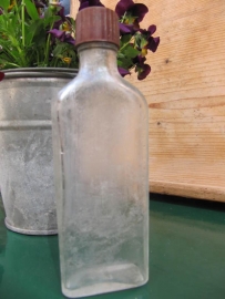 Old clear medicine bottle with screwcap