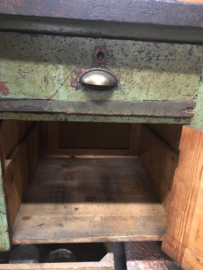 Old industrial green workbench