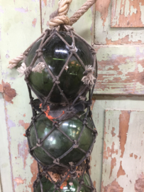 Antique French glass floats in net