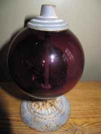 Purple glass globe on foot