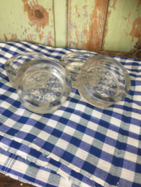 Set van 4 oude glazen kastonderzetters