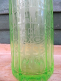 Seltzer soda bottle bright green with print