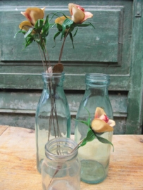 Old plastic flowers on metal, six