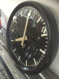 Old industrial clock, bakelite edge black dial