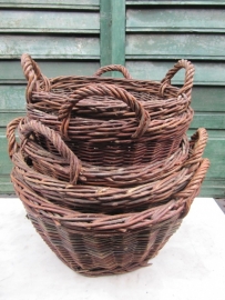 Cute old cane harvesting and wood baskets.