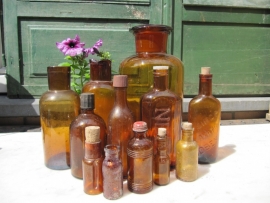 French old brown bottle with red cap Perma Paris