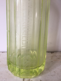 Antieke spuitfles met opdruk