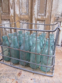 Old metal crate with 1/2 liter milkbottles