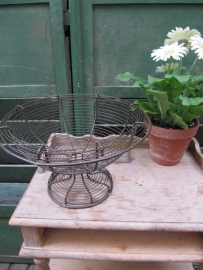 Ancient brocante eggbasket on foot