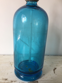 Antieke blauwe spuitfles