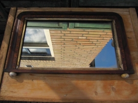 Old mirror with carved wood