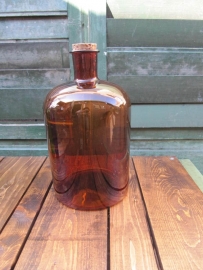 Old brown bottle of 5 liters