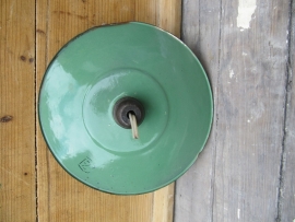 Light bulb with green enamel cap