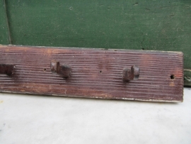 Brocante wooden coat rack with seven wooden hooks.
