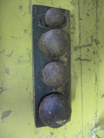 Antique bal shape weights on wooden stand
