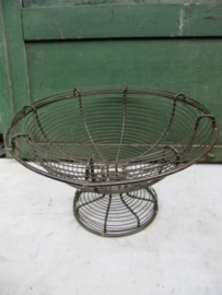 Ancient brocante eggbasket on foot