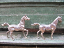 Two (silvered) horses