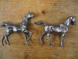 Two (silvered) horses