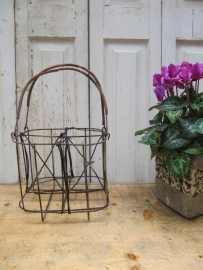 Antique basket for carrying 4 bottles.