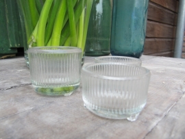 Old brocante tealight holder from glass on 3 feet
