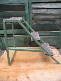 Old industrial metal ladder or stool