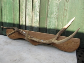 Nice part of a deer antler on shelf