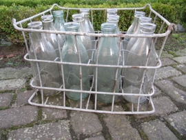 Old brocante crate with 12 milk bottles of 1 liter.