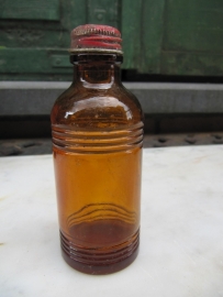 French old brown bottle with red cap Perma Paris