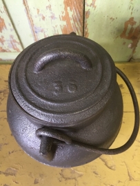 Very old cast iron small pot with 3 legs and lid