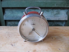 Old alarm clock with red border