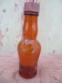 Brown medicine bottle with dial cap