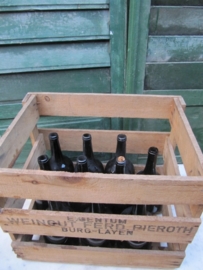 Wooden box with 10 antique wine bottles