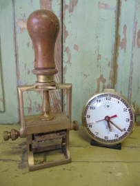 Antique brass with wooden handle date stamp.