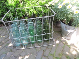 Old metal crate filled with 20 half-liter bottles in fun colors.